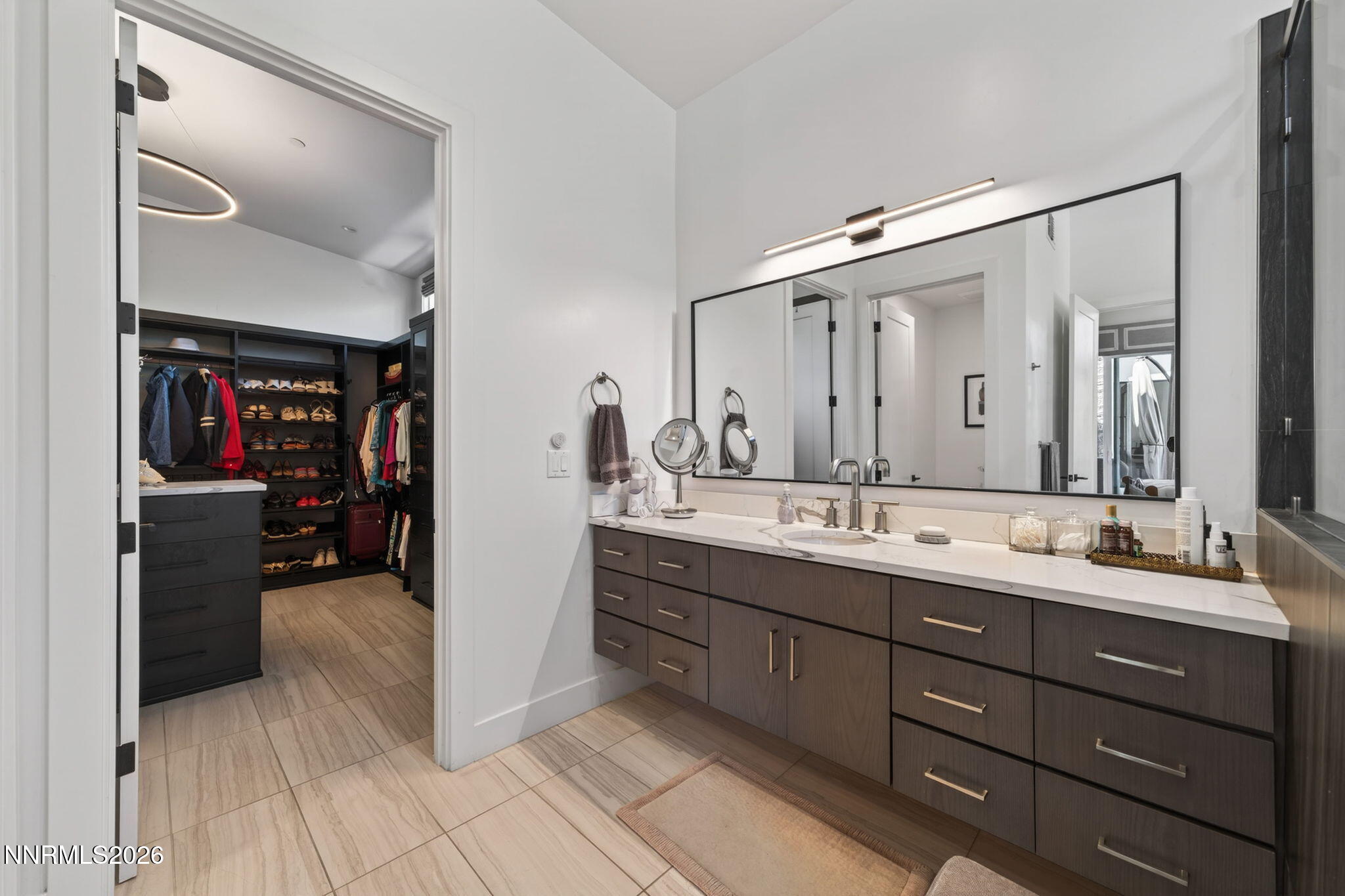 6141 Triple Crown Drive Reno, NV 89511 - Photo 60 of 71 a bathroom with a double vanity sink and a mirror