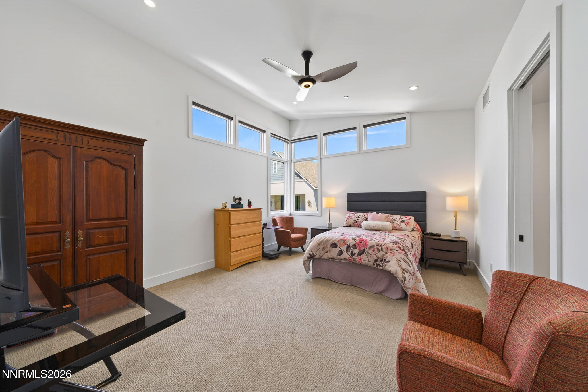 6141 Triple Crown Drive Reno, NV 89511 - Photo 62 of 71 a bedroom with a bed and a ceiling fan