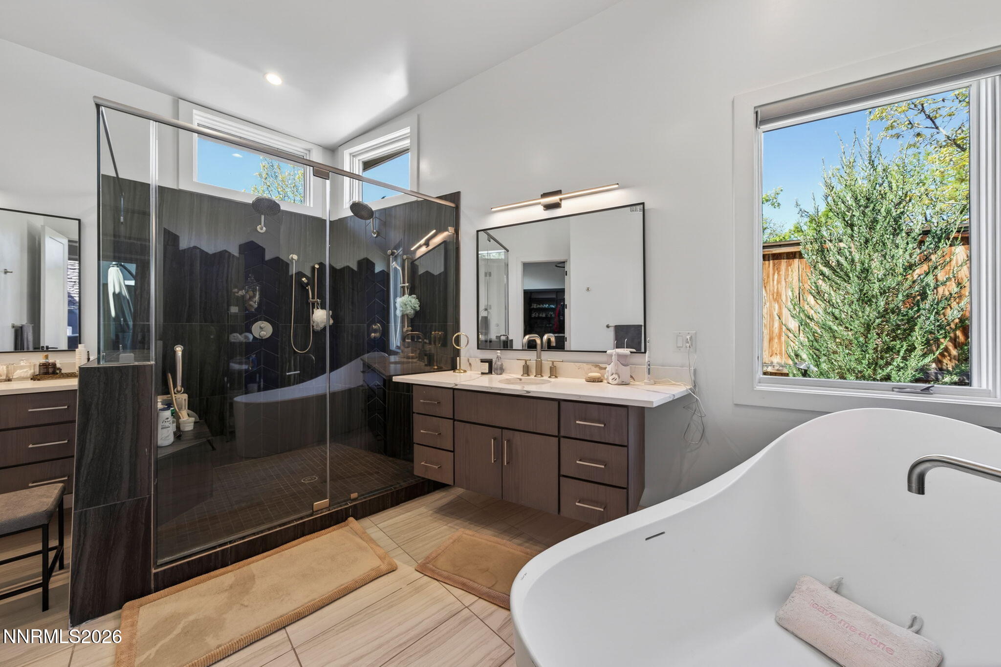 6141 Triple Crown Drive Reno, NV 89511 - Photo 64 of 71 a bathroom with a tub sink and mirror