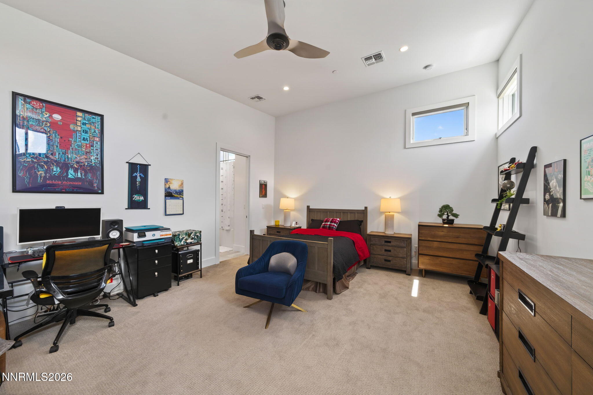 6141 Triple Crown Drive Reno, NV 89511 - Photo 65 of 71 a bedroom with furniture and a flat screen tv