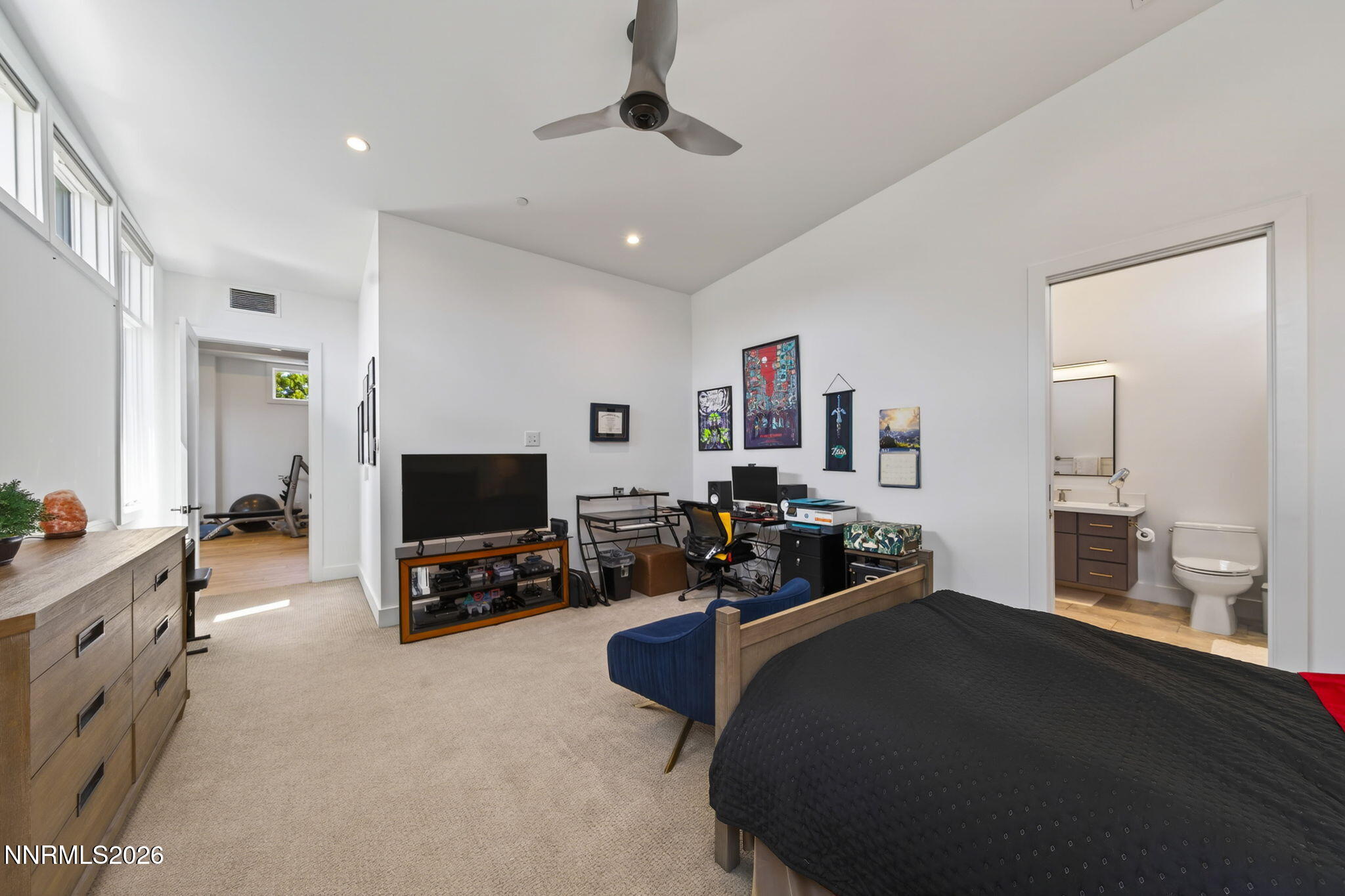 6141 Triple Crown Drive Reno, NV 89511 - Photo 66 of 71 a bedroom with furniture and a flat screen tv