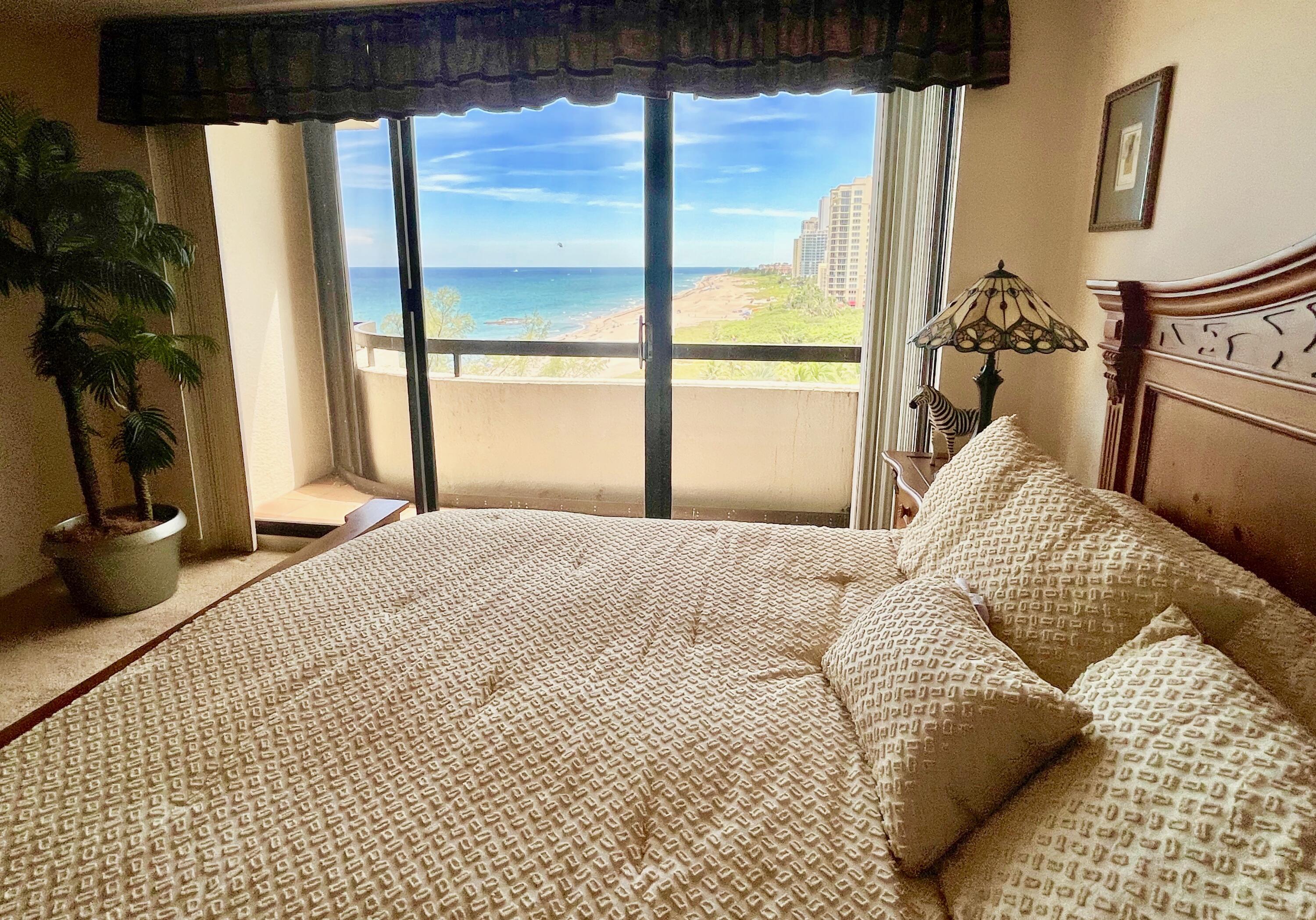 4000 North Ocean Drive, Unit 902 Singer Island, FL 33404 - Photo 21 of 53 a bedroom with a bed and a window