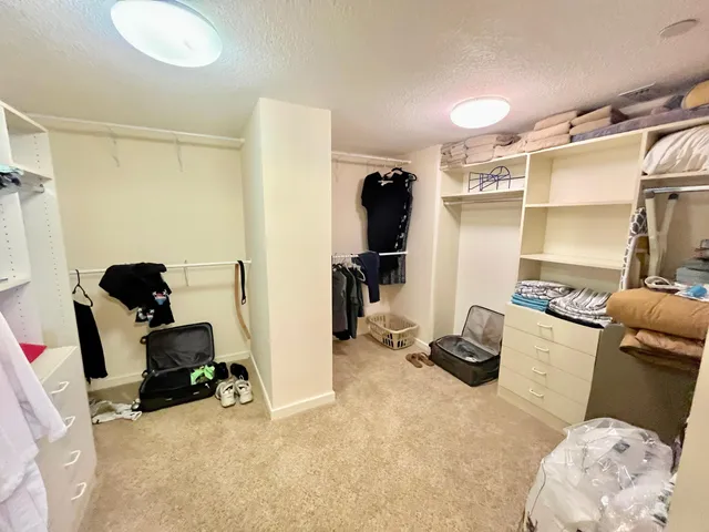 a room with furniture a air conditioner and a window