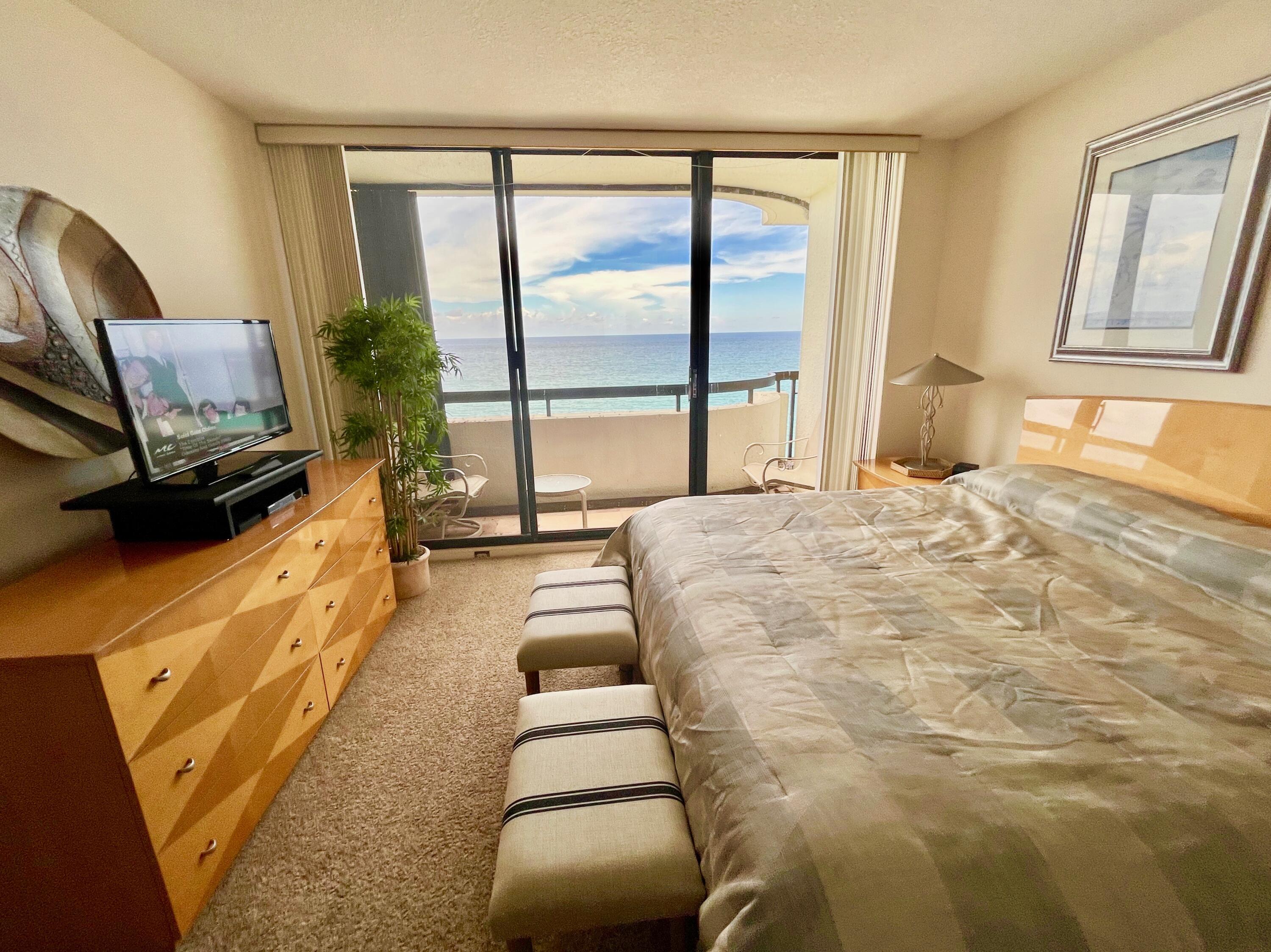 4000 North Ocean Drive, Unit 902 Singer Island, FL 33404 - Photo 26 of 53 a spacious bedroom with a large bed and a large window
