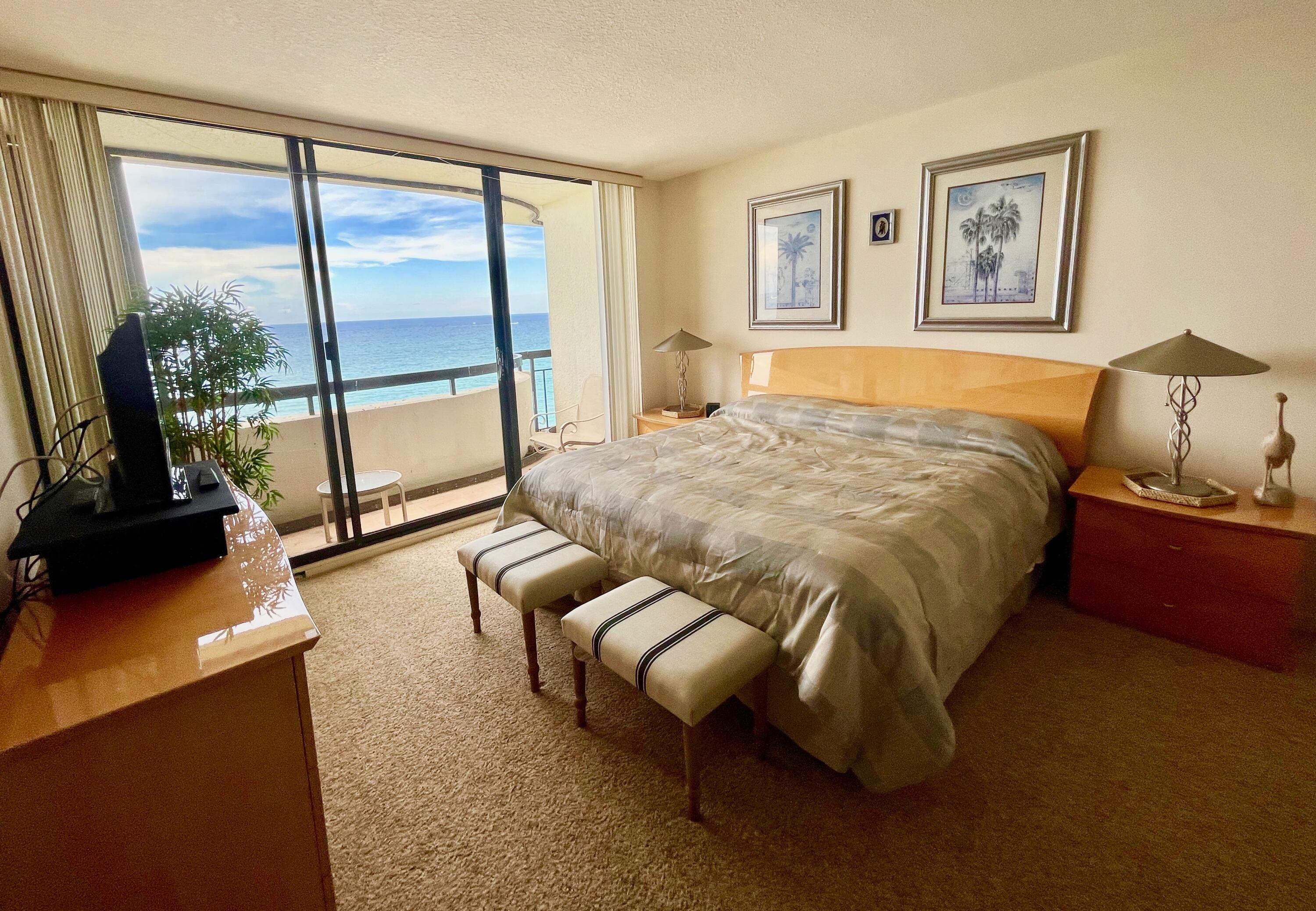 4000 North Ocean Drive, Unit 902 Singer Island, FL 33404 - Photo 27 of 53 a bed sitting in a bedroom next to a window