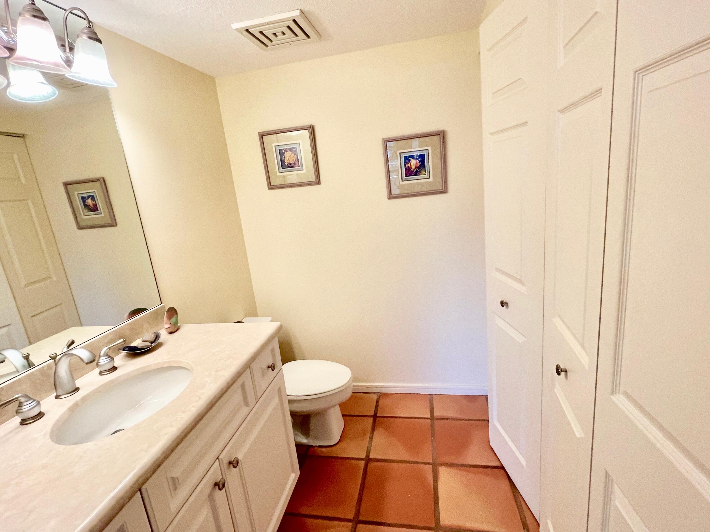 4000 North Ocean Drive, Unit 902 Singer Island, FL 33404 - Photo 30 of 53 a bathroom with a sink and a mirror