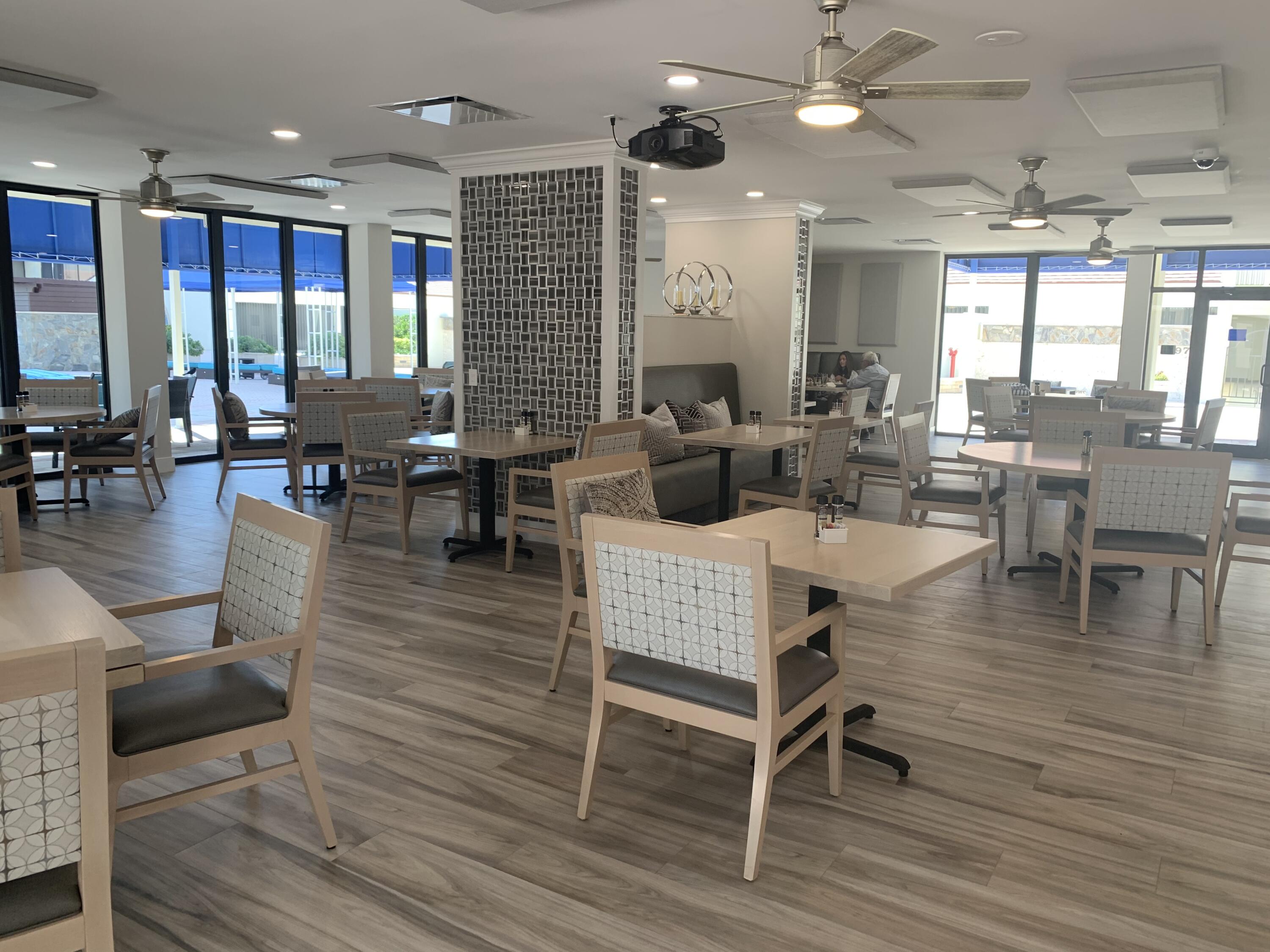 4000 North Ocean Drive, Unit 902 Singer Island, FL 33404 - Photo 33 of 53 a living room with furniture a large window and wooden floor