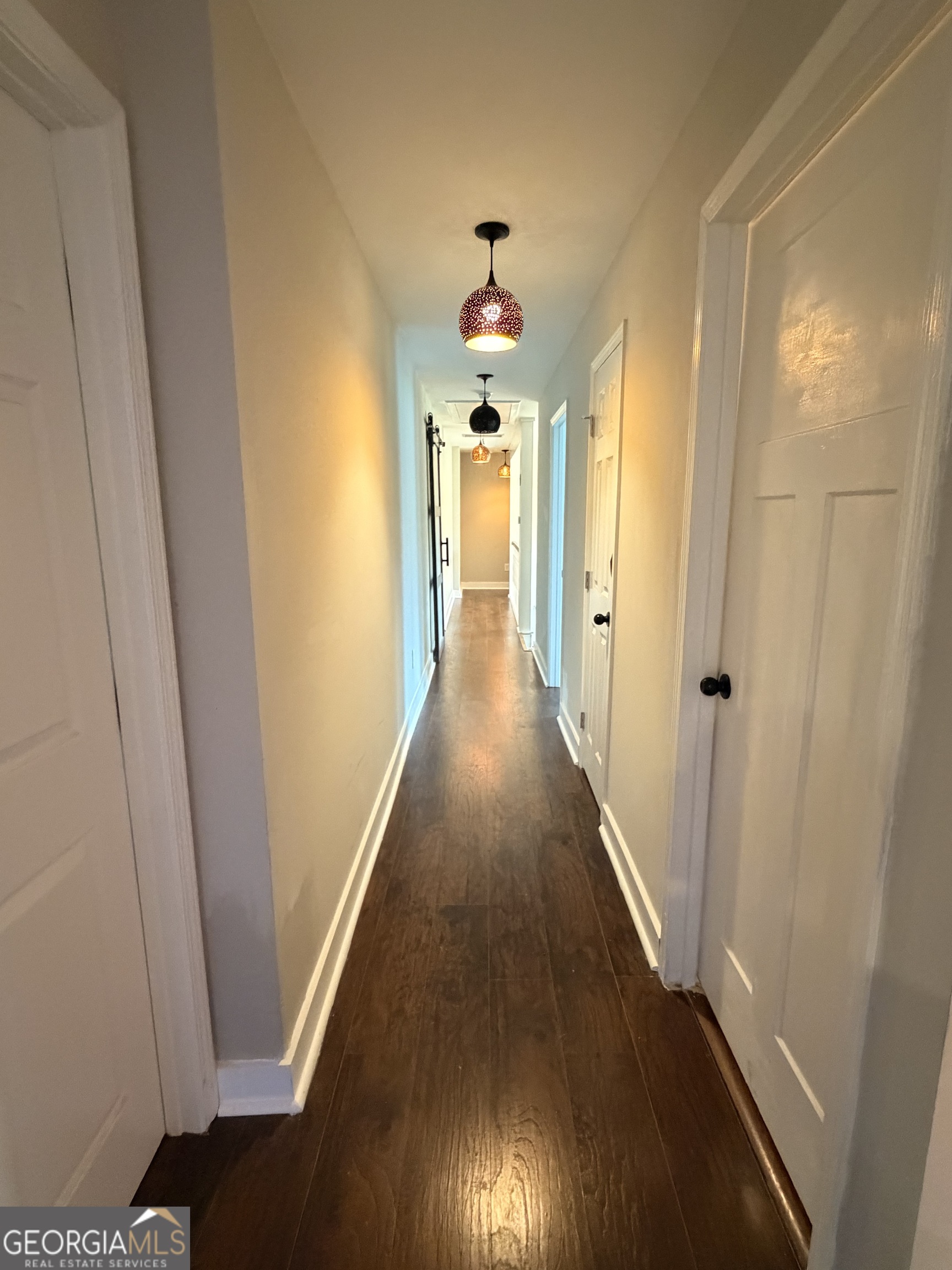 892 Perimeter Road Monticello, GA 31064 - Photo 18 of 38 a view of a hallway with wooden floor and staircase
