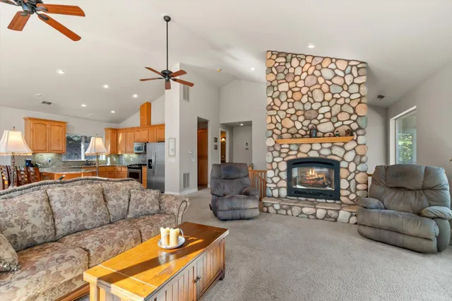 a living room with furniture fireplace and a flat screen tv