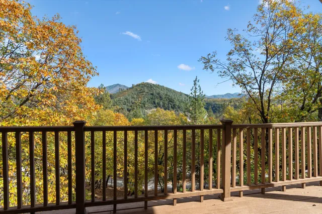 a view of a wooden house with a yard