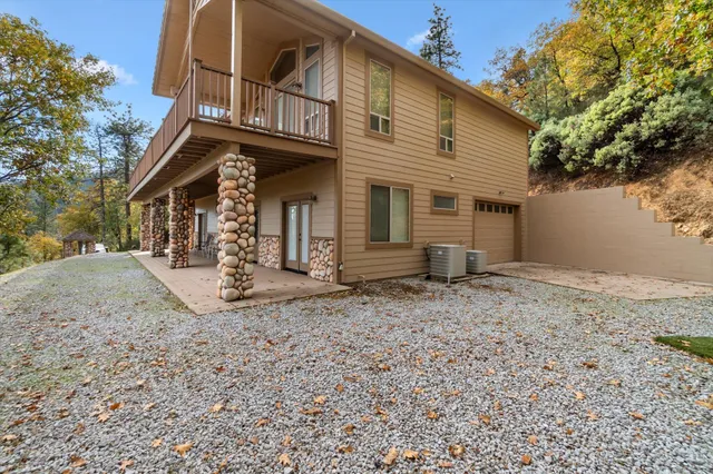 a view of a lake in middle of the forest