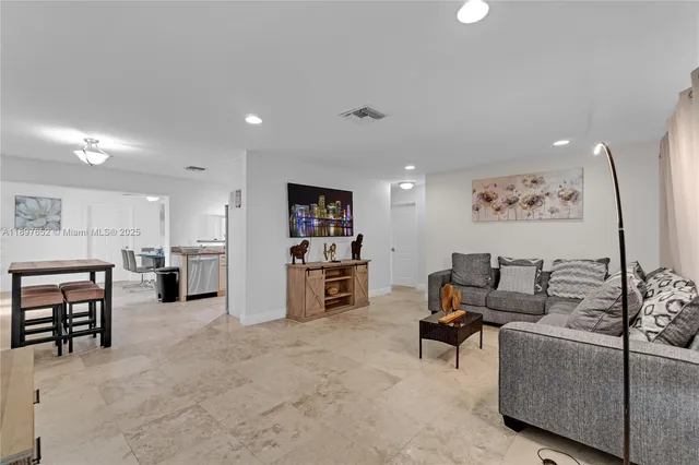 a living room with furniture and a couch