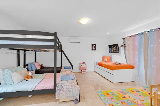 a bathroom with a granite countertop sink toilet a mirror and shower