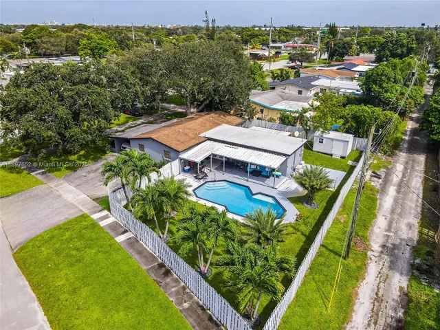 an aerial view of a house with a garden