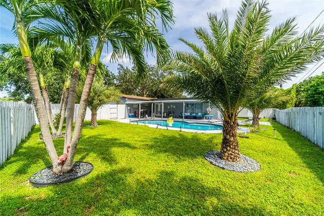 a view of a swimming pool with a patio