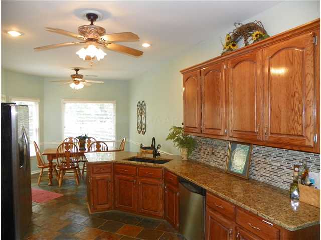 730 Coleherne Road Collierville, TN 38017 - Photo 5 of 12 Kitchen also includes breakfast bar...adjoining breakfast area overlooks pool.