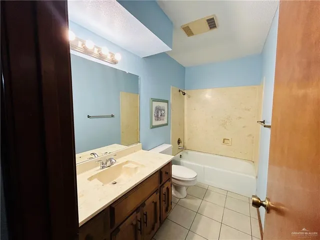 a view of a bathroom from a hallway