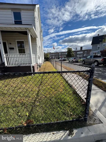 a view of a backyard with sitting area