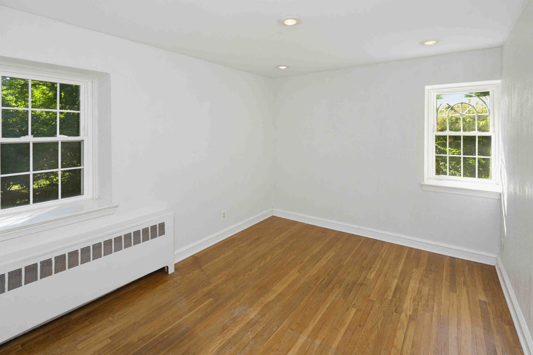 1268 Rydal Road Jenkintown, PA 19046 - Photo 29 of 31 a view of an empty room with wooden floor and a window