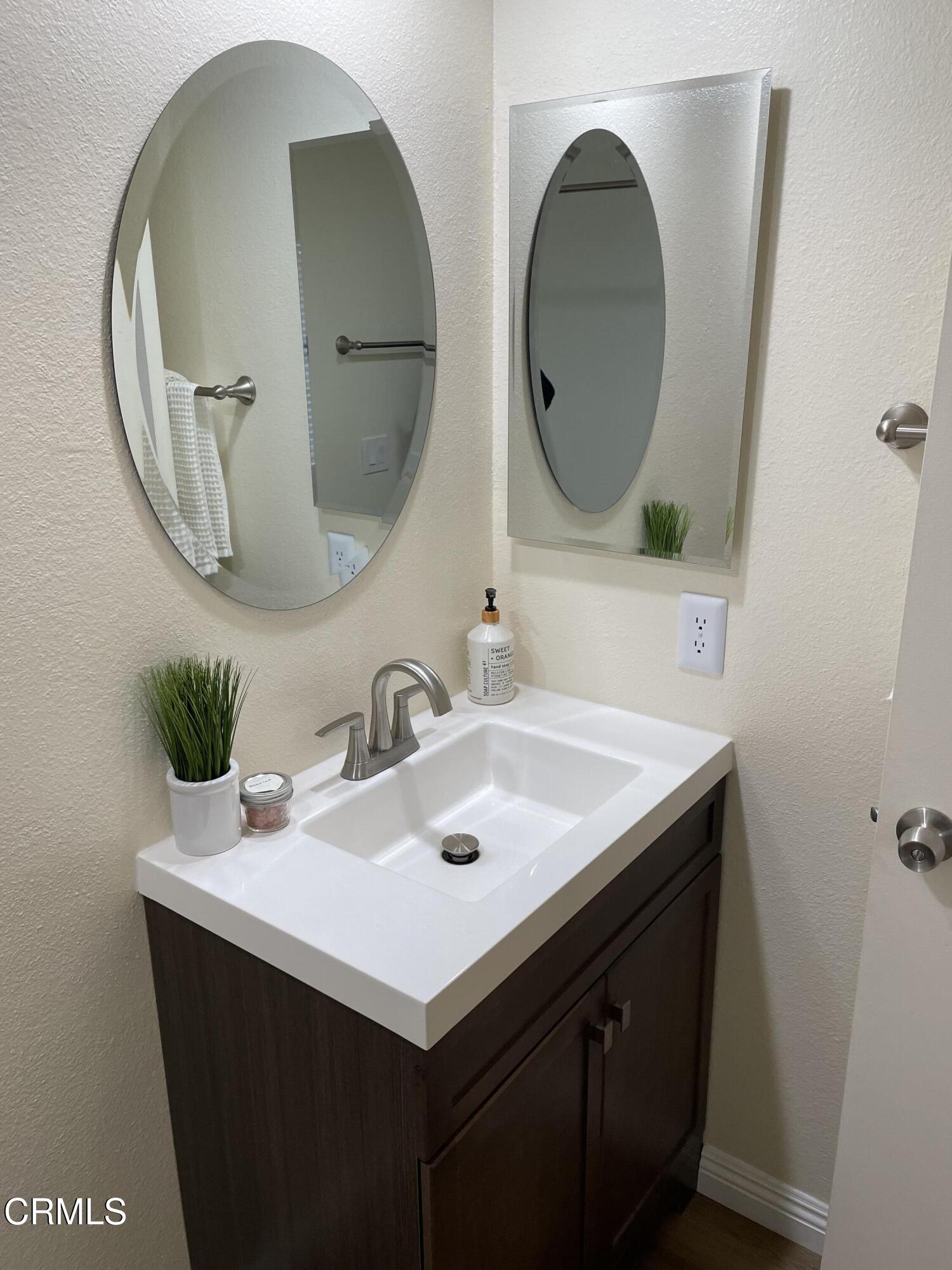 2585 Pheasant Hill Road Camarillo, CA 93010 - Photo 11 of 23 a bathroom with a sink and a mirror