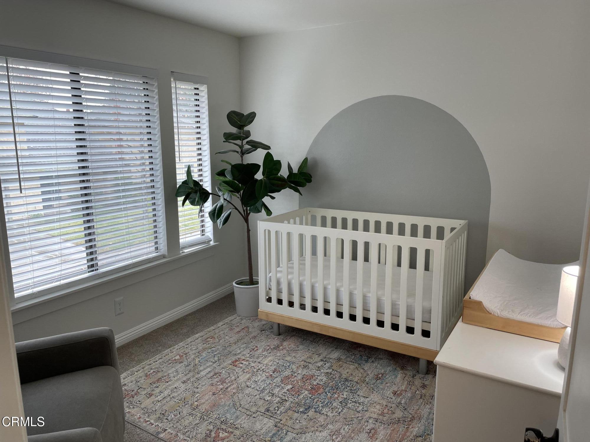 2585 Pheasant Hill Road Camarillo, CA 93010 - Photo 12 of 23 a view of a bedroom with furniture and a window