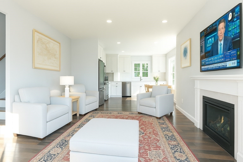 8 Ambrose Way, Unit 8 Shirley, MA 01464 - Photo 6 of 21 a living room with furniture and a fireplace