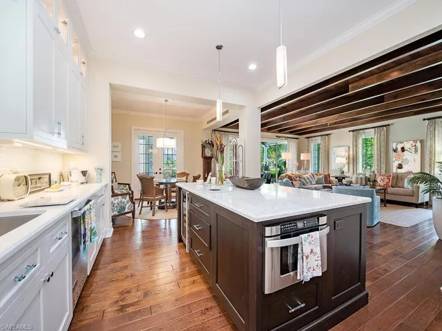 a kitchen with counter space and wooden floor