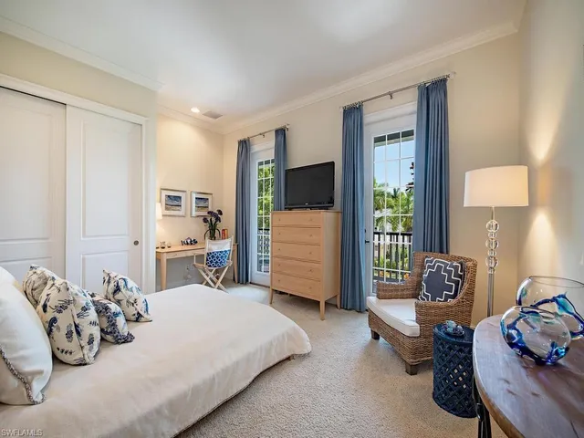 a bedroom with furniture and a window