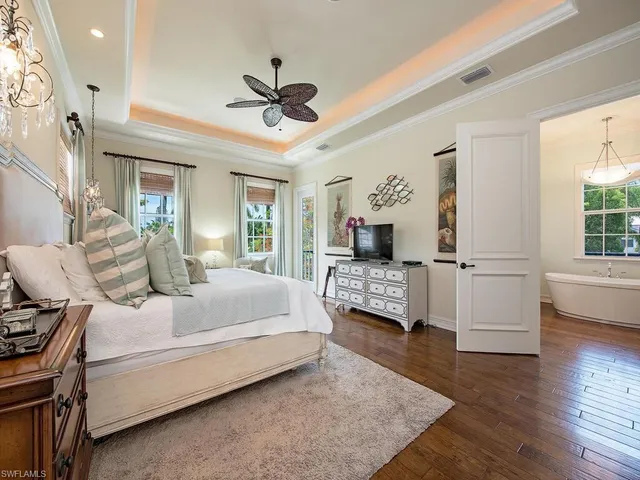 a living room with bed furniture and a window
