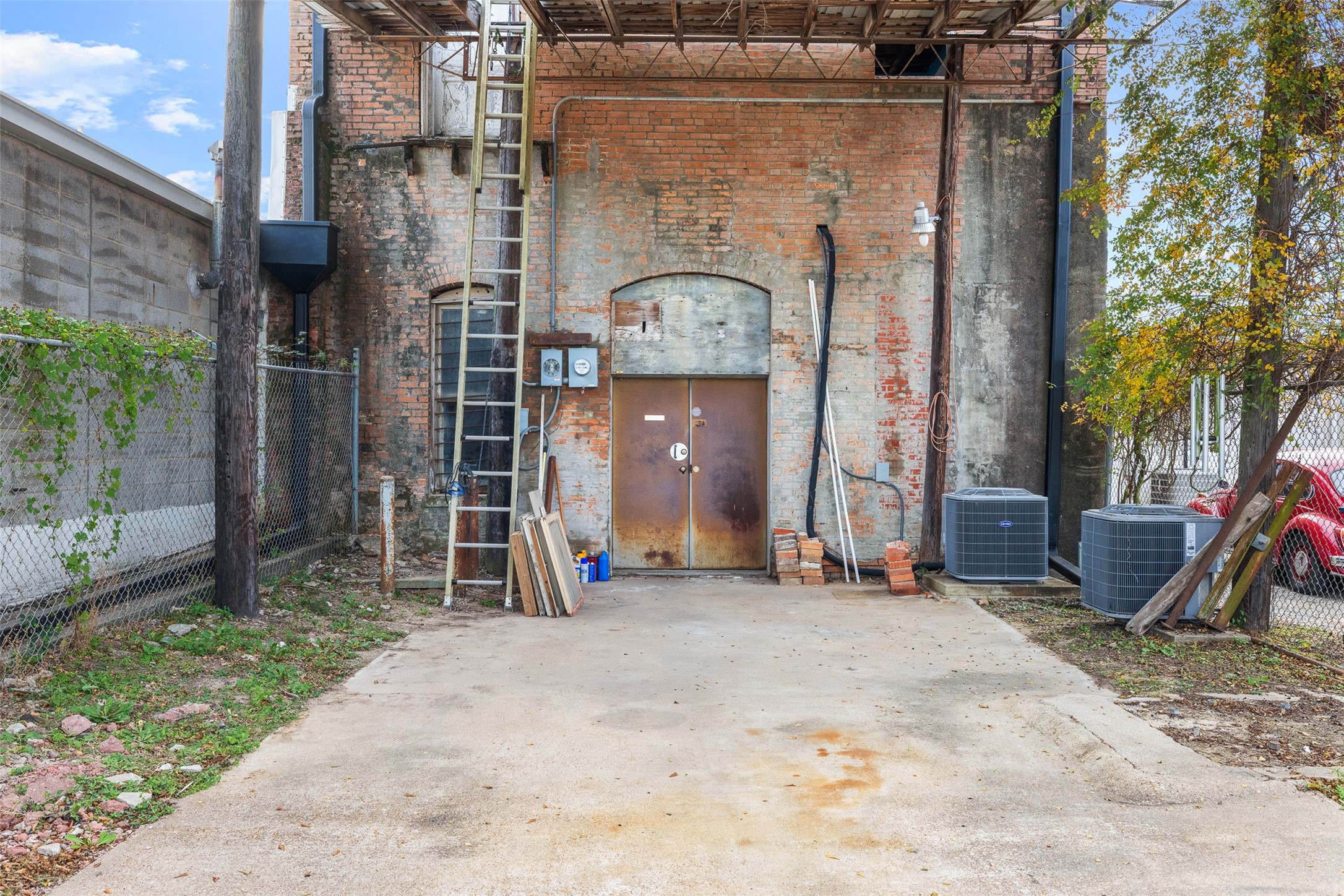 922 East Commerce Street Buffalo, TX 75831 - Photo 5 of 26 a view of a wooden door with a bench in front of house