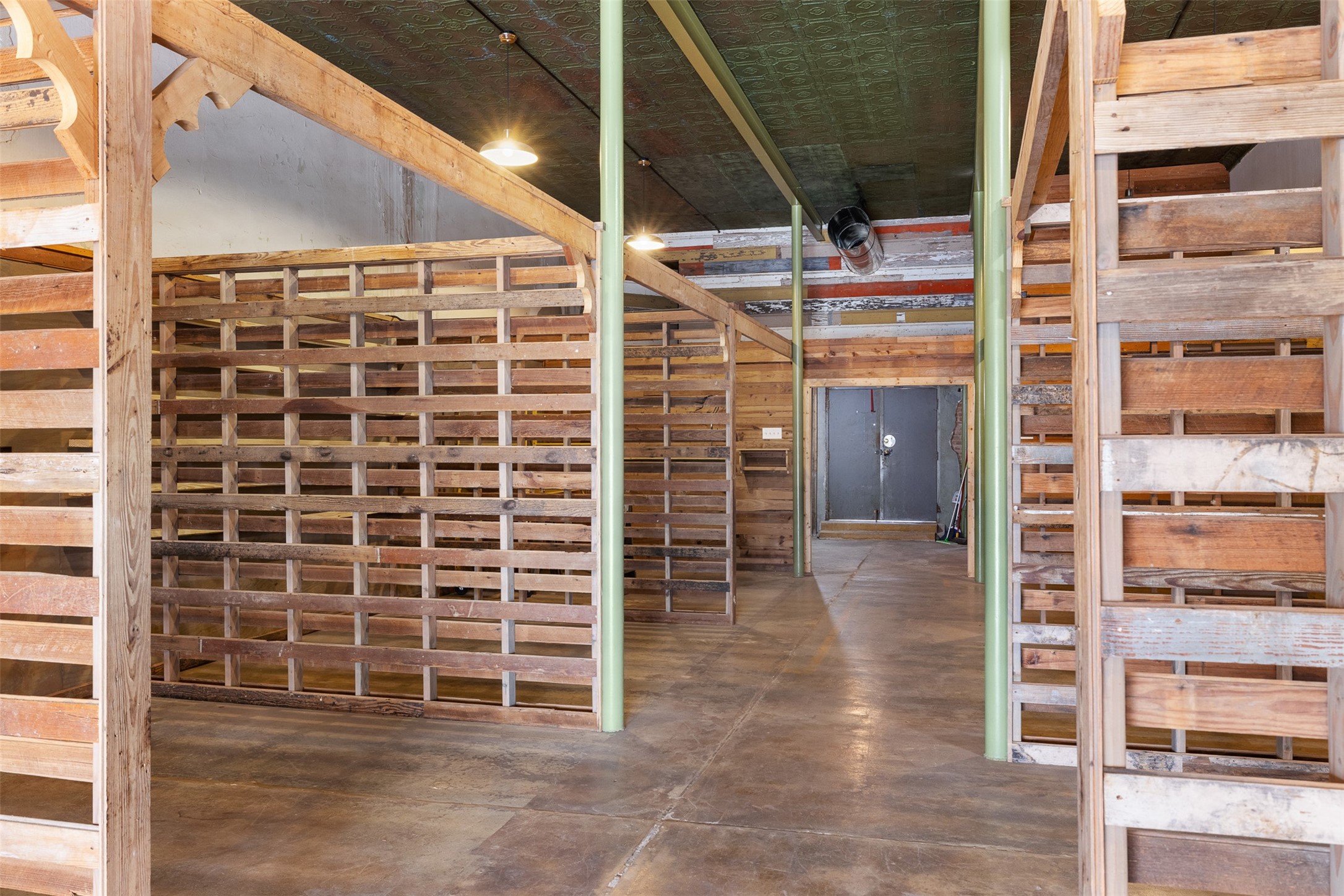 922 East Commerce Street Buffalo, TX 75831 - Photo 9 of 26 a view of an empty room with wooden floor and windows