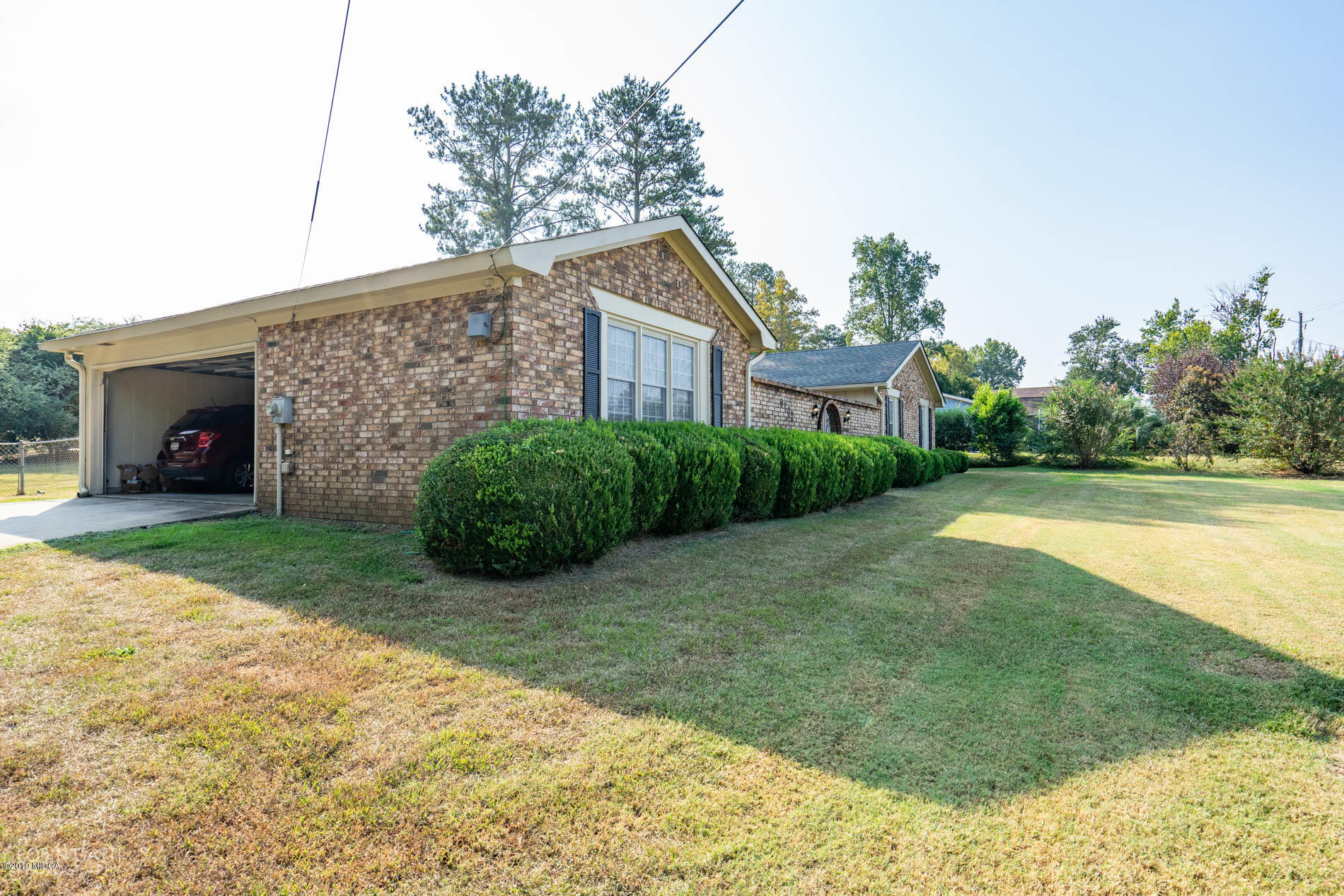 6702 Goodall Mill Road Macon, GA 31216 - Photo 3 of 32 a view of a house with a yard and potted plants