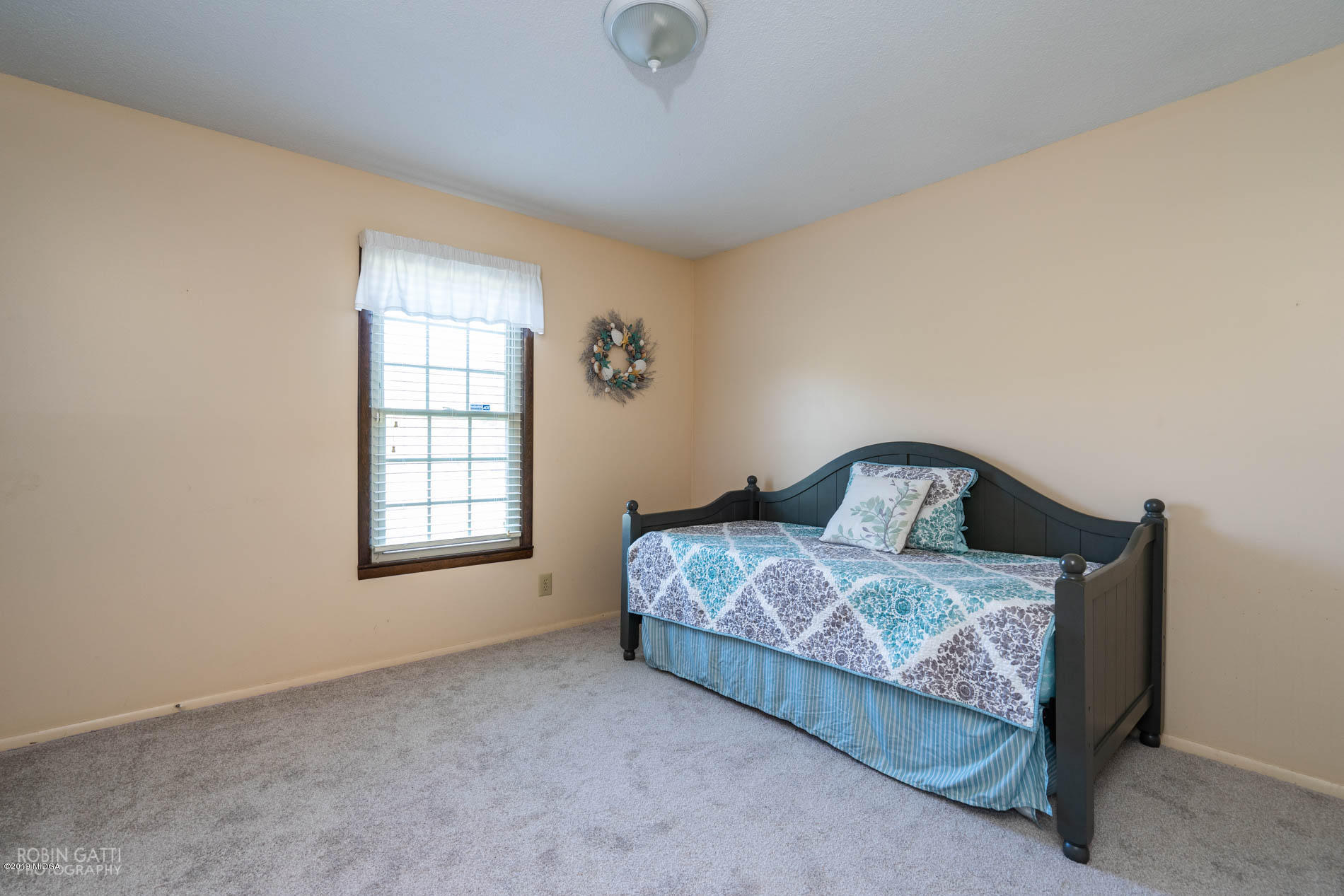 6702 Goodall Mill Road Macon, GA 31216 - Photo 25 of 32 a bedroom with a bed and window