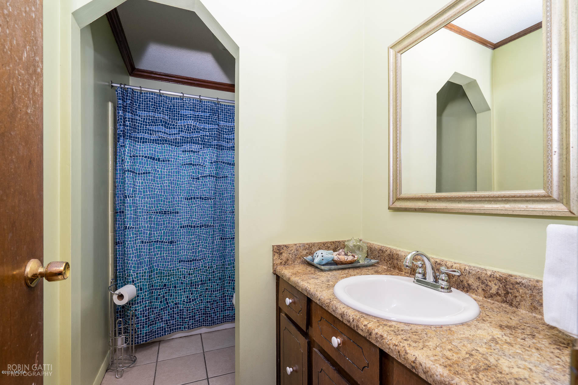 6702 Goodall Mill Road Macon, GA 31216 - Photo 32 of 32 a bathroom with a granite countertop sink and a mirror