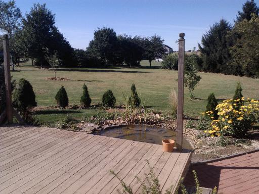 903 Preserve Road Shabbona, IL 60550 - Photo 8 of 13 a view of a lake with a bench