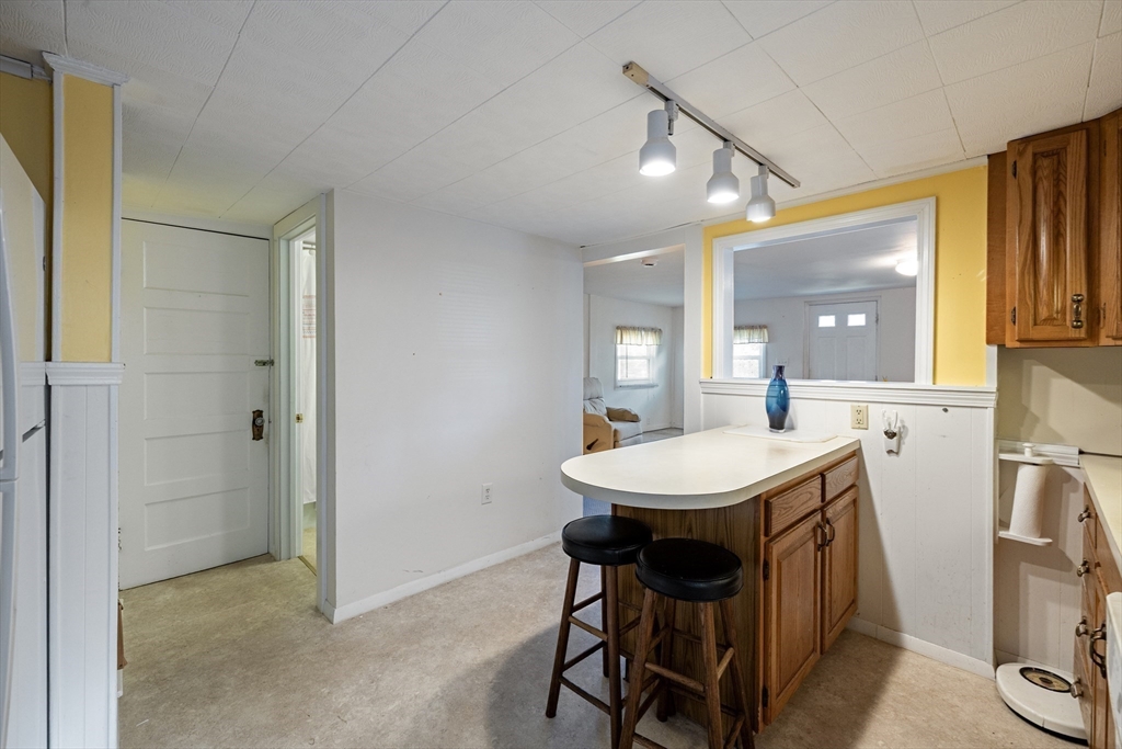 111 Thaddeus Street Chicopee, MA 01020 - Photo 11 of 32 a dining room with a sink and breakfast area
