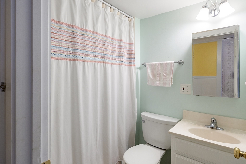 111 Thaddeus Street Chicopee, MA 01020 - Photo 16 of 32 a bathroom with a sink a toilet and mirror