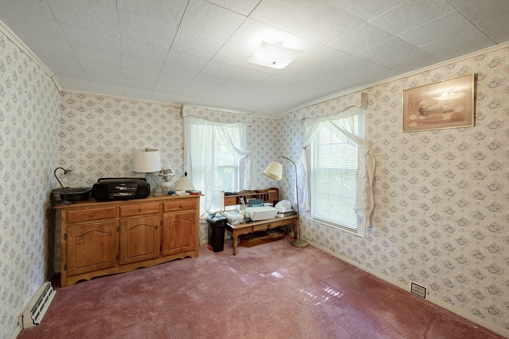 111 Thaddeus Street Chicopee, MA 01020 - Photo 19 of 32 a room with furniture a window and a couch