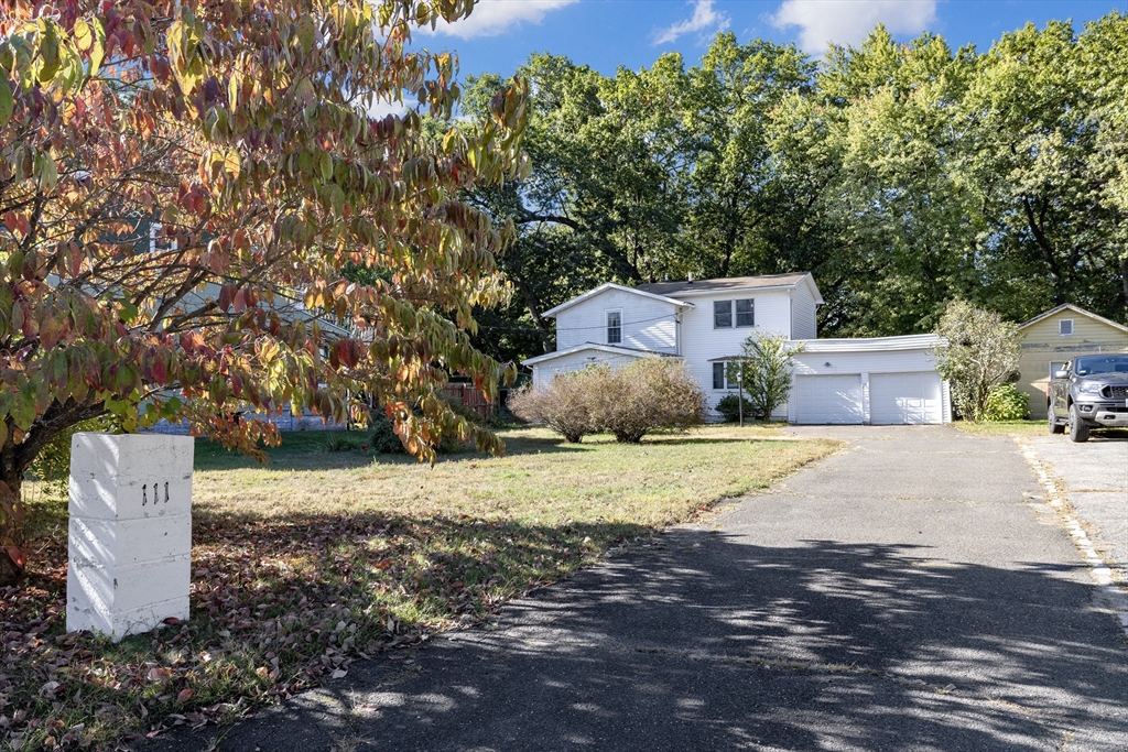 111 Thaddeus Street Chicopee, MA 01020 - Photo 2 of 32 a table and chairs sitting in the middle of a yard