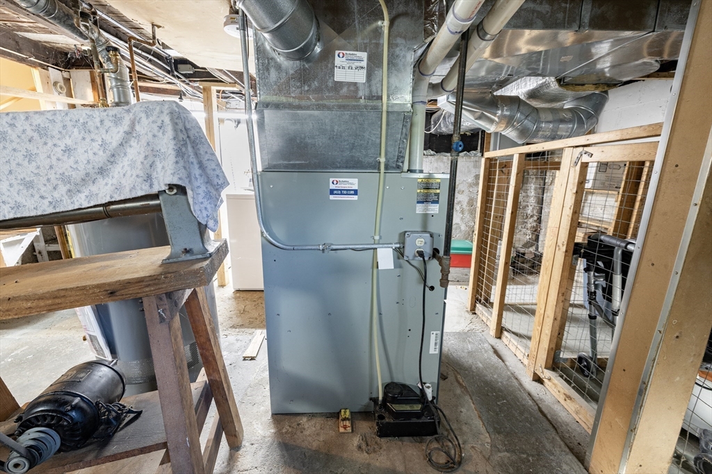 111 Thaddeus Street Chicopee, MA 01020 - Photo 31 of 32 a view of walk in closet with clothes and shoes