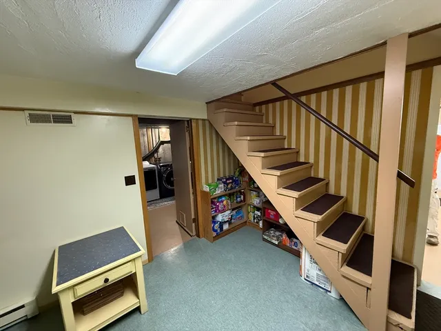 a room with stairs and white walls