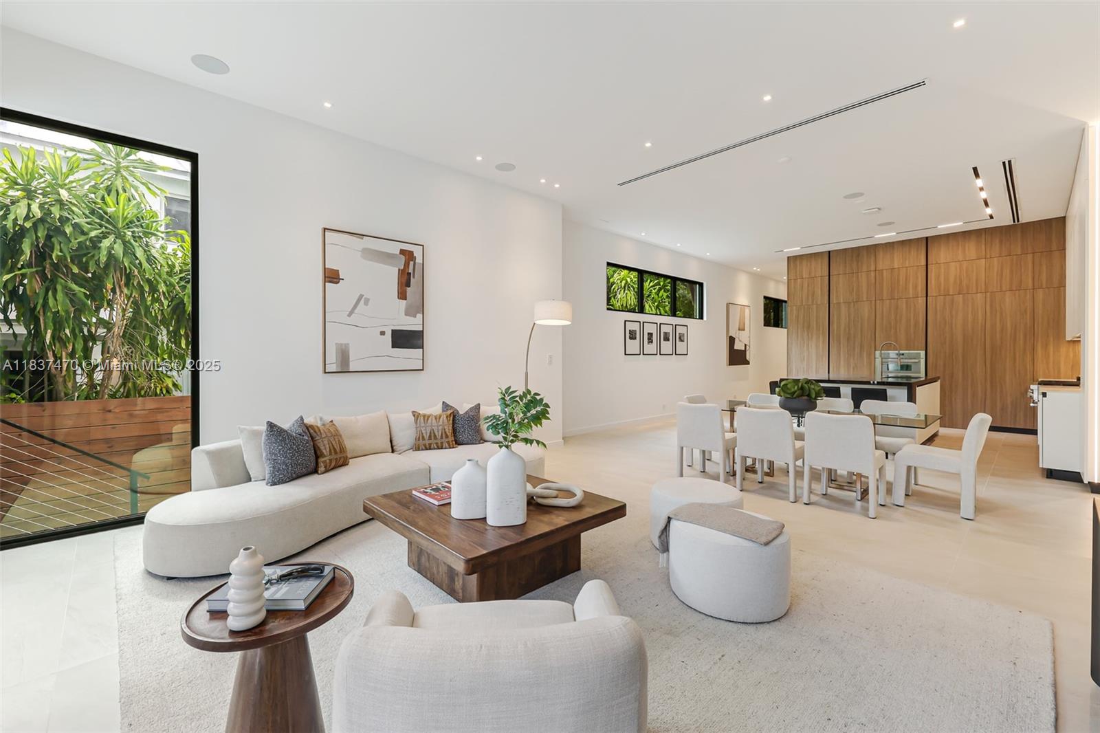 2824 Coconut Avenue, Unit 2824 Miami, FL 33133 - Photo 13 of 31 a living room with furniture and a large window