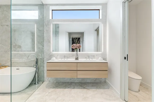 a bathroom with a bathtub and a toilet