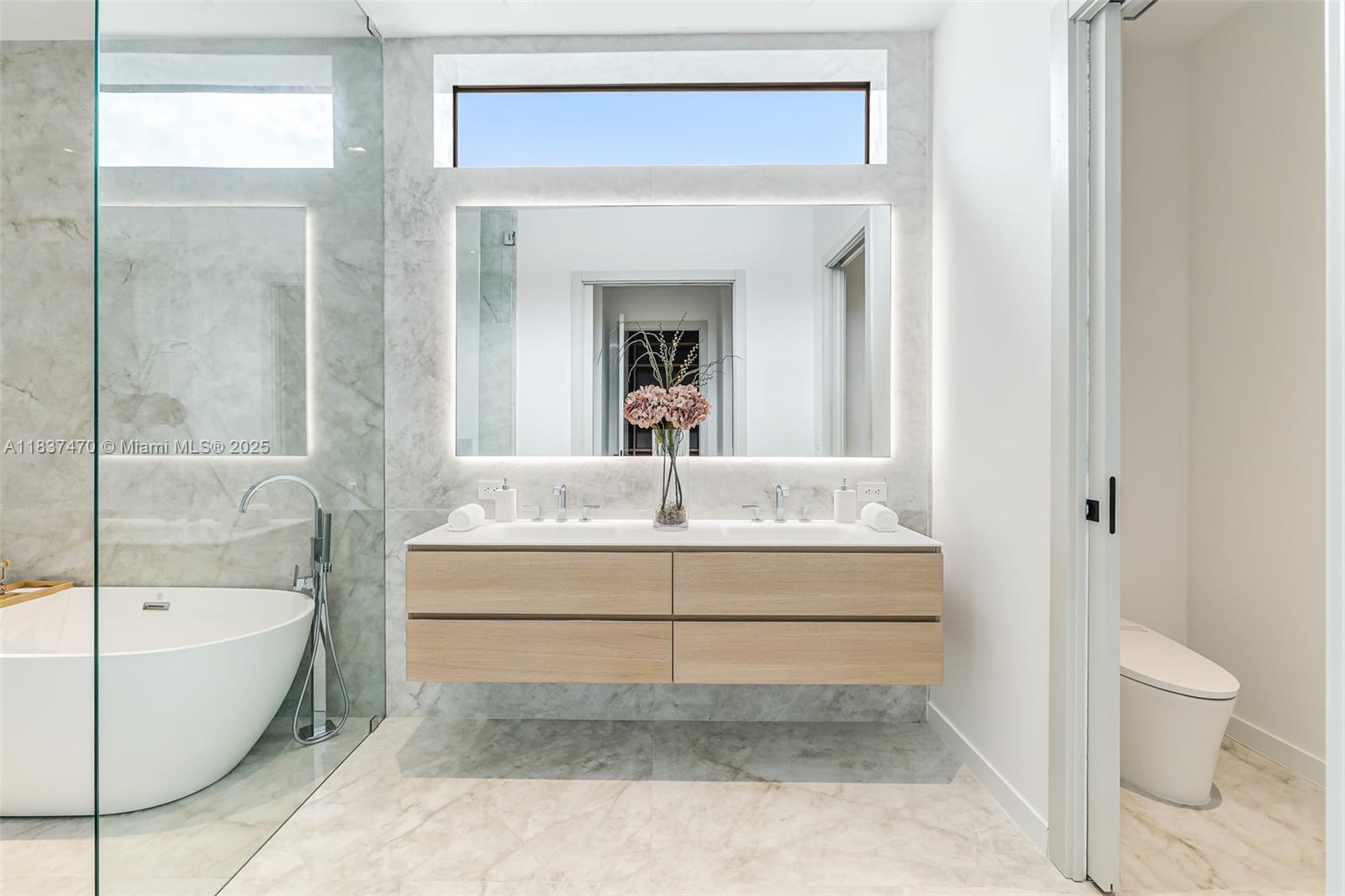 2824 Coconut Avenue, Unit 2824 Miami, FL 33133 - Photo 15 of 31 a bathroom with a bathtub and a toilet