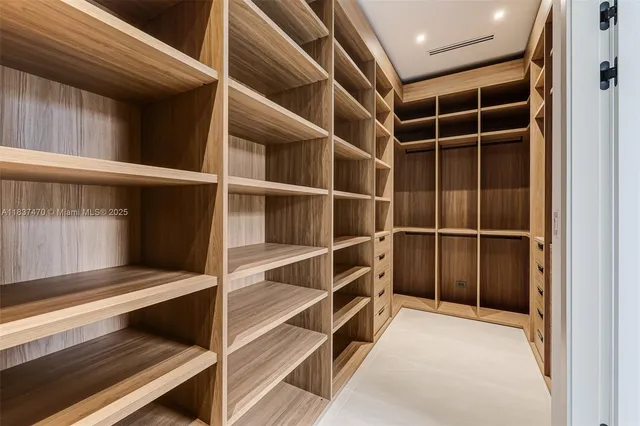 a view of an empty room with a staircase