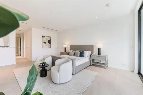 a bed room with a bed and a night stand