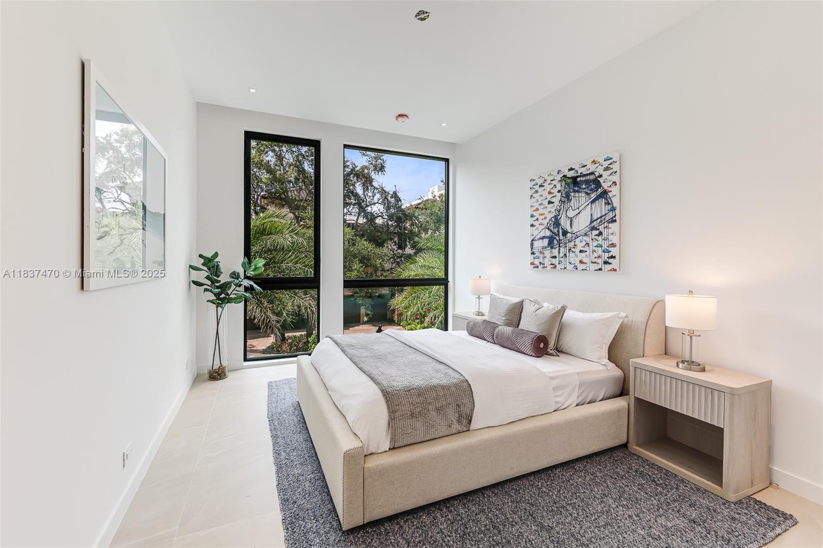 2824 Coconut Avenue, Unit 2824 Miami, FL 33133 - Photo 20 of 31 a bedroom with a large bed and a window