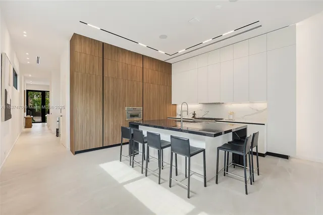 a kitchen with a table and chairs in it