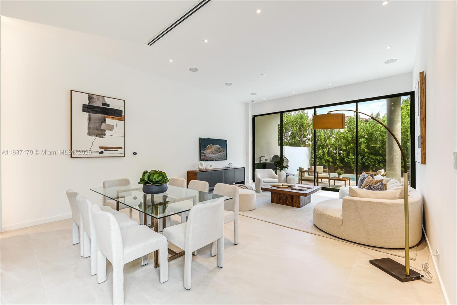 2824 Coconut Avenue, Unit 2824 Miami, FL 33133 - Photo 10 of 31 a living room with furniture and a large window
