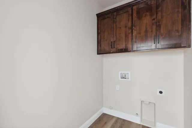 a view of cabinets and wooden floor